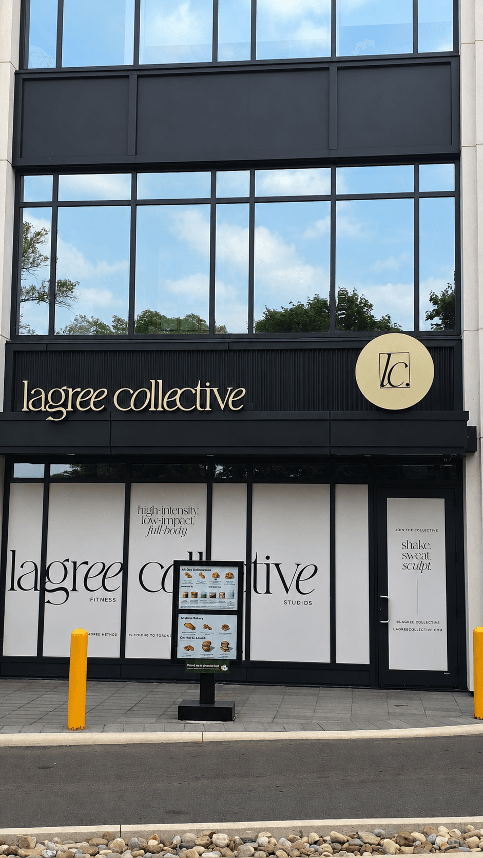 Lagree Collective storefront with illuminated wordmark sign and circular logo badge