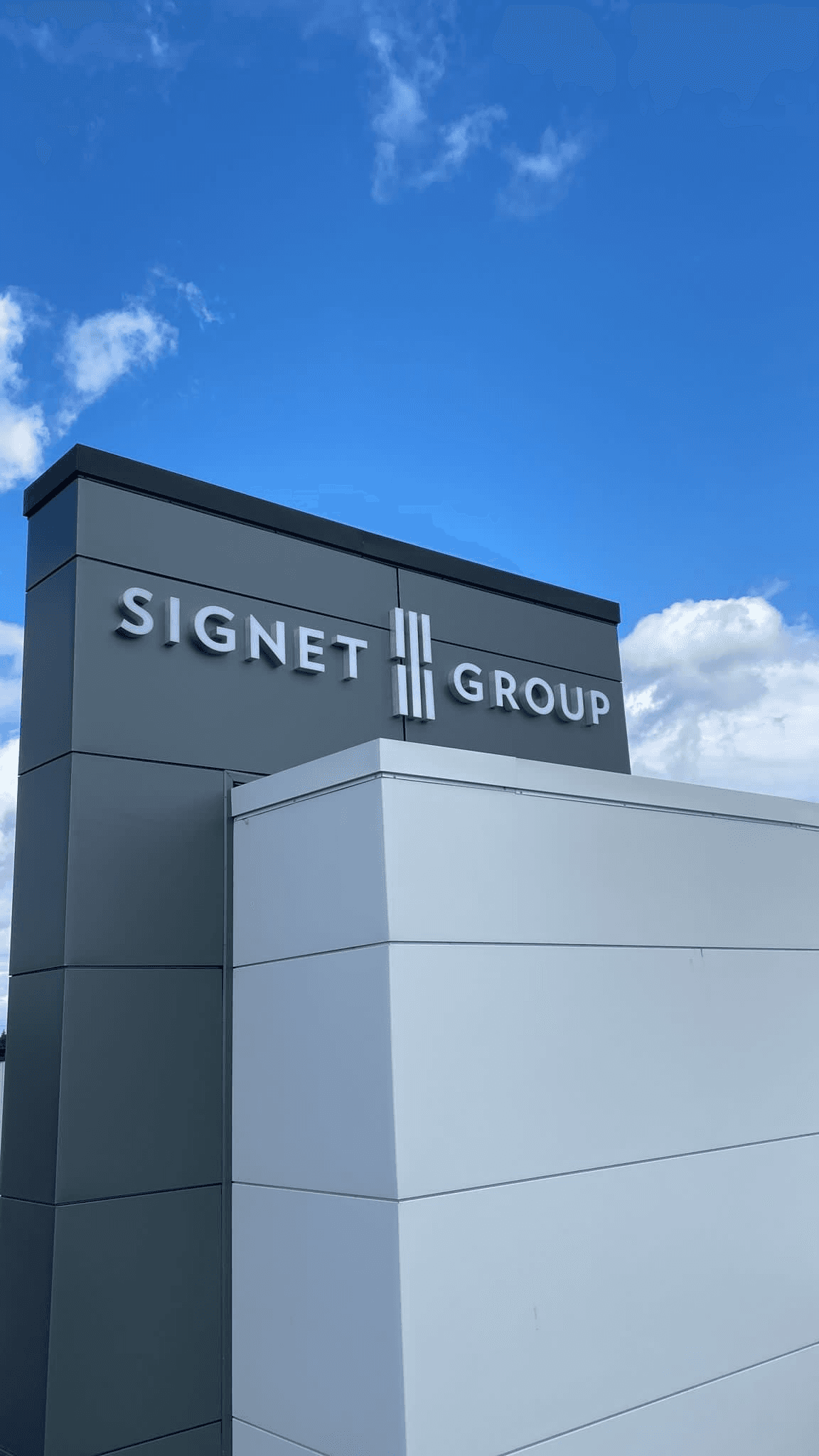 Signet Group dimensional letter signage and logo on a two-tone ACM panel monument structure